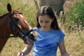 Teenage girl and her horse Royalty Free Stock Photo