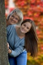 Teenage girl and her mother in autumnal nature Royalty Free Stock Photo