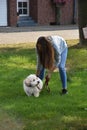 Teenage girl and her mulish havanese dog