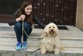 Teenage girl and her sweet little tiver dog Royalty Free Stock Photo