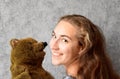 Teenage girl and her teddy bear Royalty Free Stock Photo