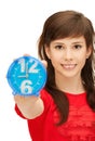 Teenage girl holding alarm clock Royalty Free Stock Photo