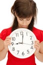 Teenage girl holding big clock Royalty Free Stock Photo