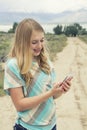 Teenage girl holding a bouquet of orange wildflowers outdoors