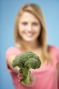 Teenage Girl Holding Fresh Broccoli Royalty Free Stock Photo