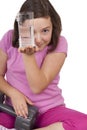 Teenage girl holding glass of water and weight
