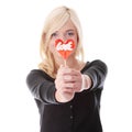 Teenage girl holding red heart shaped lollipop Royalty Free Stock Photo