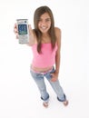 Teenage girl holding up cellular phone Royalty Free Stock Photo
