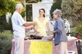 Teenage Girl Holding Yard Sale Royalty Free Stock Photo