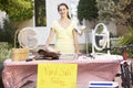 Teenage Girl Holding Yard Sale Royalty Free Stock Photo