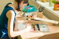 Teenage girl at home is engaged in creativity, drawing watercolor at a table in room. Child creativity, recreation, development Royalty Free Stock Photo