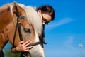 Teenage girl with horse Royalty Free Stock Photo