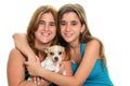 Teenage girl hugging her mother and their little dog Royalty Free Stock Photo