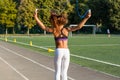 A teenage girl jumping rope in a school stadium