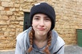 A teenage girl with a knitted hat