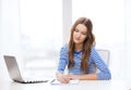 Teenage girl laptop computer and notebook Royalty Free Stock Photo