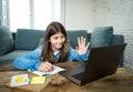 Teenage girl on laptop studying online at home as high school is closed due to new COVID-19 Lockdown Royalty Free Stock Photo