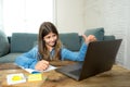 Teenage girl on laptop studying online at home as high school is closed due to new COVID-19 Lockdown Royalty Free Stock Photo