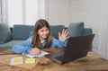 Teenage girl on laptop studying online at home as high school is closed due to new COVID-19 Lockdown Royalty Free Stock Photo