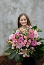 Teenage girl with large bunch of flowers Royalty Free Stock Photo