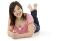 Teenage Girl Laying on Stomach Royalty Free Stock Photo