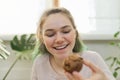Teenage girl leads culinary vlog, girl shows freshly baked chocolate muffin