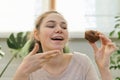 Teenage girl leads culinary vlog, girl shows freshly baked chocolate muffin