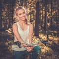 Teenage girl listens music on a bicycle outdoors Royalty Free Stock Photo