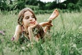 Teenage girl with long hair and bare feet  in the grass Royalty Free Stock Photo