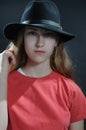 Teenage girl with long hair and black hat Royalty Free Stock Photo