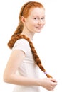 Teenage girl with long red plait Royalty Free Stock Photo