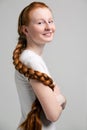 Teenage girl with long red plait Royalty Free Stock Photo