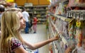 Teenage girl looking at candy Royalty Free Stock Photo