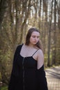 Teenage girl looking down while walking on path Royalty Free Stock Photo