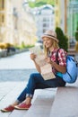 Teenage girl looking at map. Tourism and Vacation concept Royalty Free Stock Photo