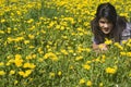 Teenage girl lying in spring meadow Royalty Free Stock Photo