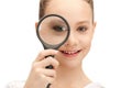 Teenage girl with magnifying glass