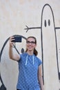 Selfie in front of graffiti wall Royalty Free Stock Photo