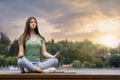 Teenage girl meditating near rive Royalty Free Stock Photo