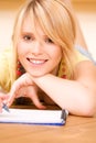 Teenage girl with notebook and pen