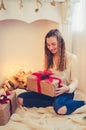 Teenage girl opening the present Royalty Free Stock Photo