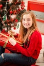 Teenage girl opening the present Royalty Free Stock Photo