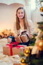 Teenage girl opening the present Royalty Free Stock Photo