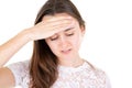 Teenage girl in pain having headache hand on head on white background