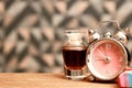 Teenage girl perfume and hair accessories and fancy clock on the table