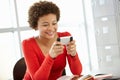 Teenage girl with phone in class Royalty Free Stock Photo