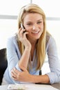 Teenage girl with phone in class Royalty Free Stock Photo