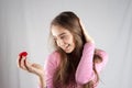 Teenage girl in pink with plush heart Royalty Free Stock Photo