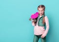 Teenage girl with pink skateboard