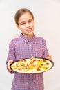 Teen girl holding frying pan with raw sweet pizza Royalty Free Stock Photo